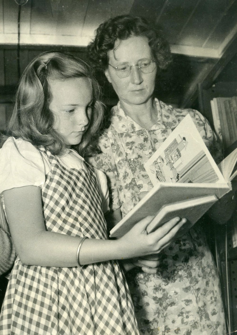Miss Jean Briton advising a young Brooklyn reader.