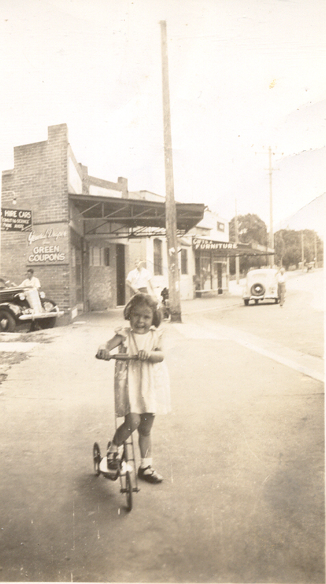 Girl on scooter, Pacific Highway, Hornsby