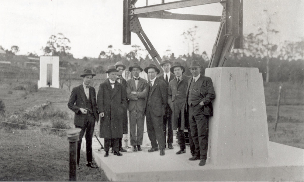Engineers standing on mast anchorage at Pennant Hills Radio Station