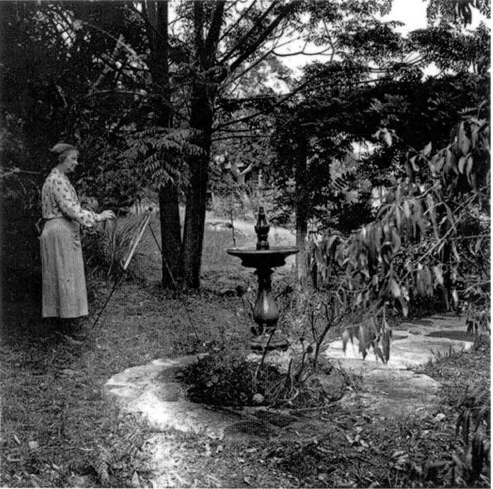 Margaret Preston painting in her garden.