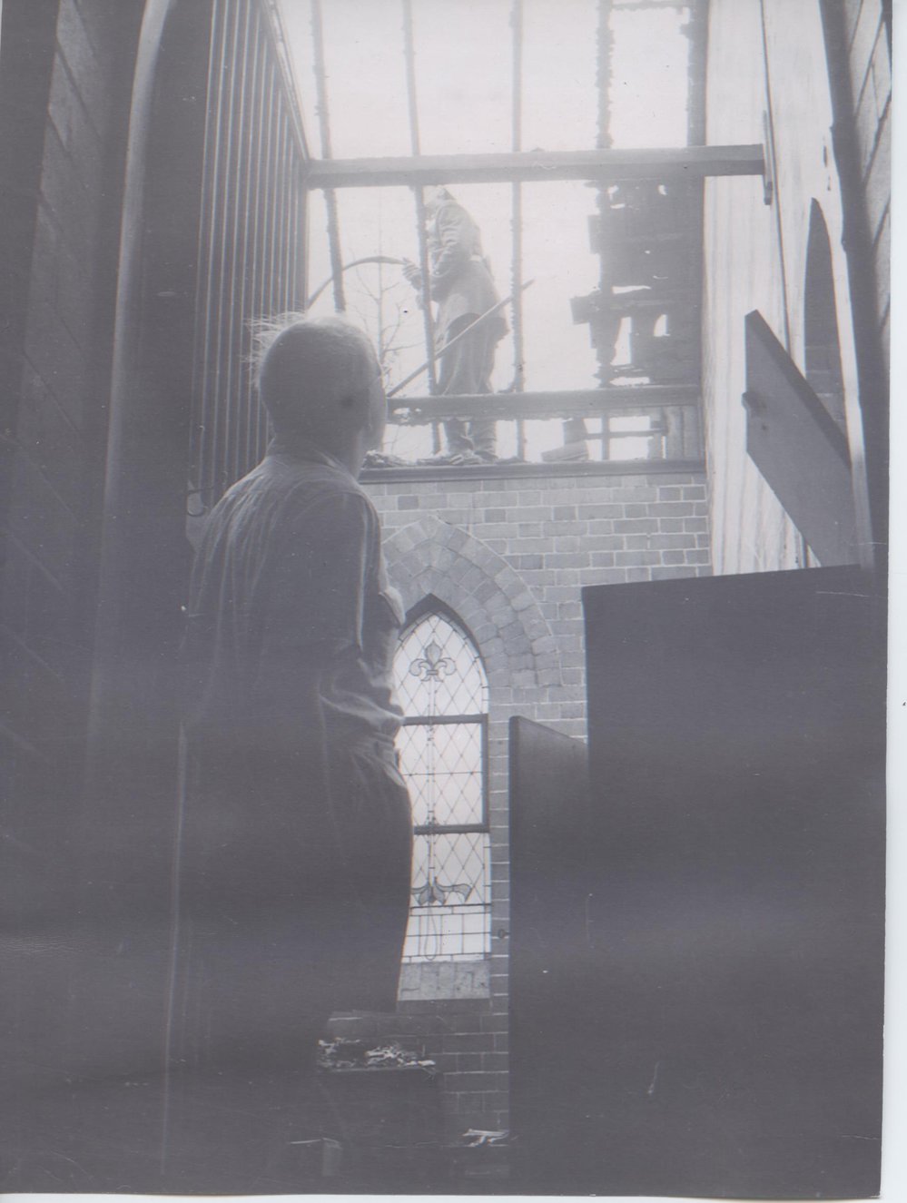 Rev. Ray Chapple in St. Peter's Church after the 1957 bushfire