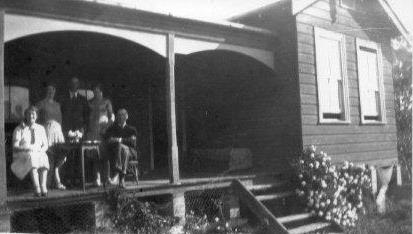 Moody family on verandah of their house in Hull Rd, Pennant Hills