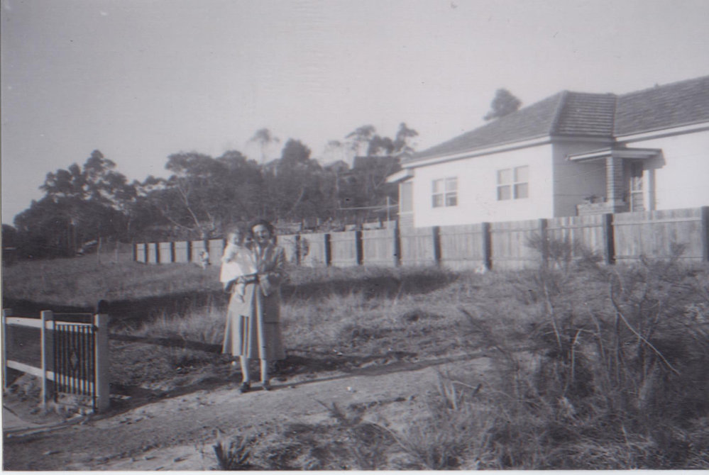 Noela and Cheryl Hatch in front of their block