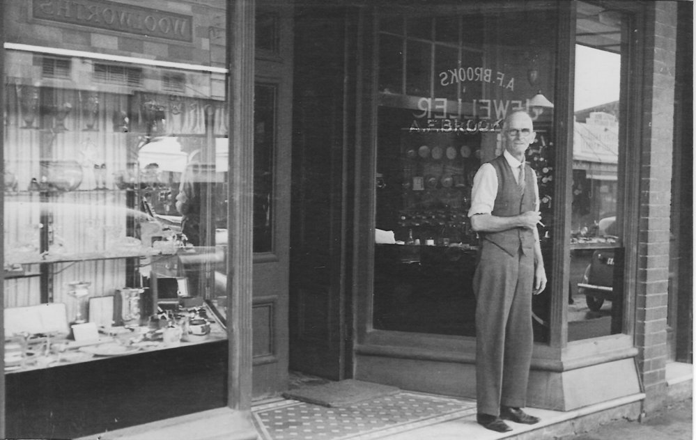 Arthur Brooks in front of his store