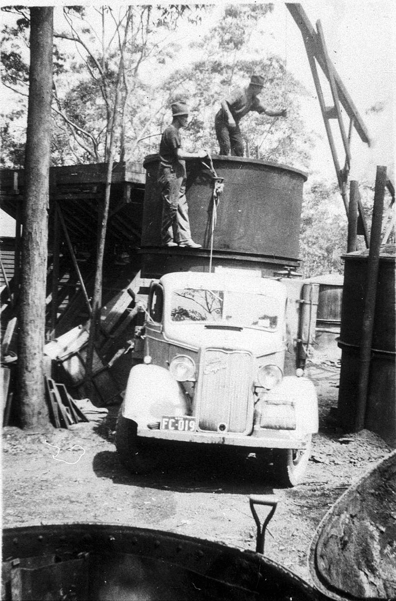 Lifting charcoal kiln off truck in West Pennant Hills
