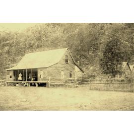 Burton and Mary Crossland in front of the two-storey guest house c.1890
