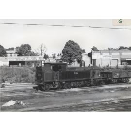 Tank engine shunting a locomotive coal engine with Jersey Street, Hornsby, in the background.