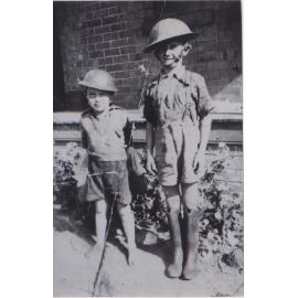 Ted Young (wearing fathers helmet) and Ron Young (with copy)