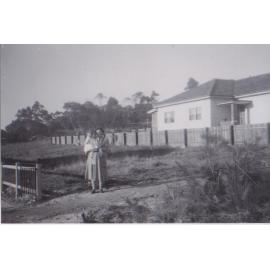 Noela and Cheryl Hatch in front of their block