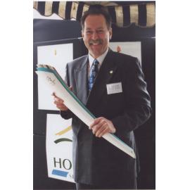 General Manager, Robert Ball, holding the Hornsby Shire Council torch at Pennant Hills Park