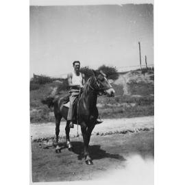 Tom Carter riding Bill Lyons' horse