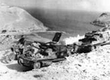 1941-07.Two captured Italian carro veloce CV33 tankettes on the road over looking Bardia Harbour. Bardia can be seen on the far hill.1941-07.Two captured Italian carro veloce CV33 tankettes on the road over looking Bardia Harbour. Bardia can be seen on the far hill.