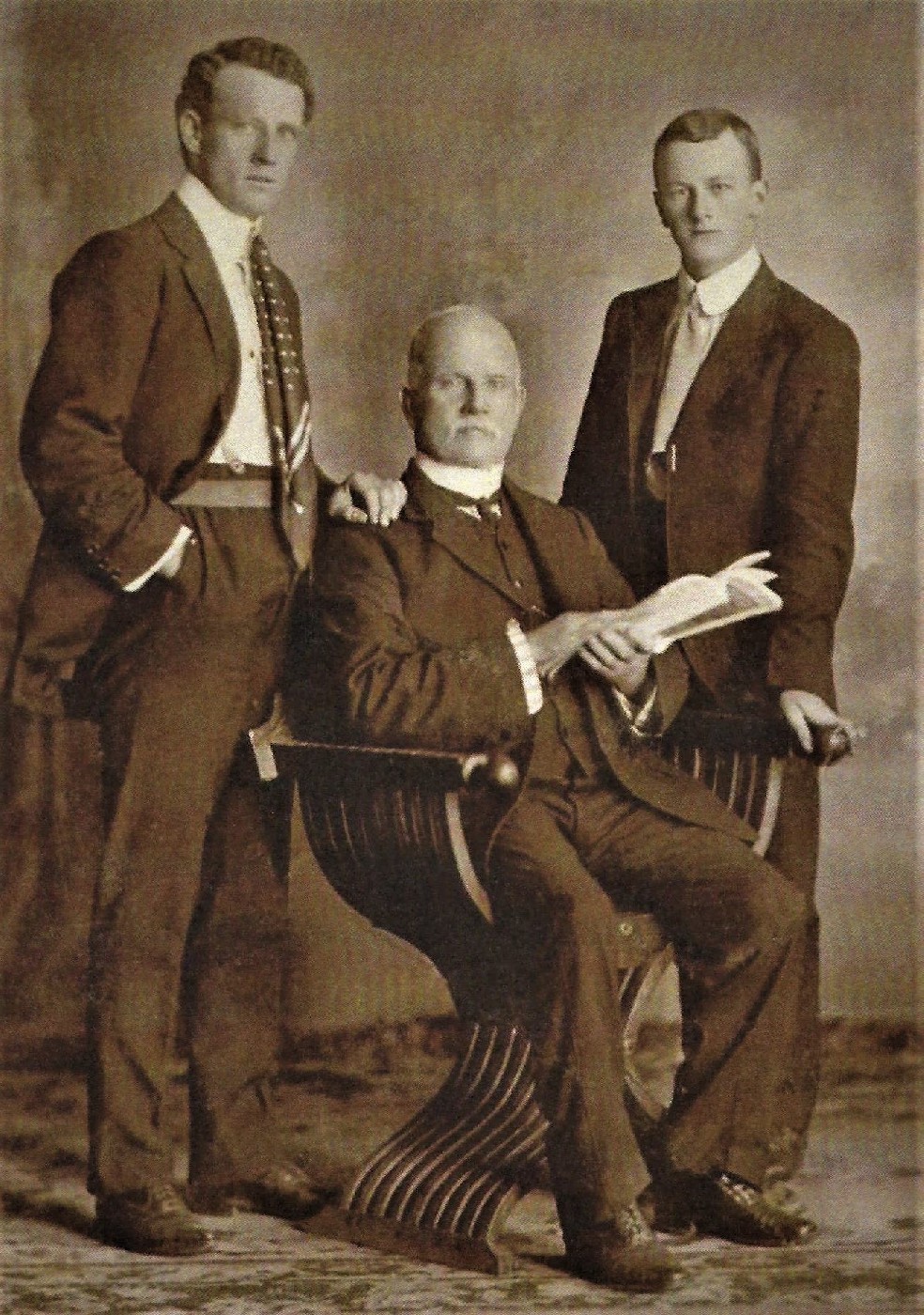 Captain Robert Francis Talbot with two of his sons Hugh on his right and Leslie on his left.
