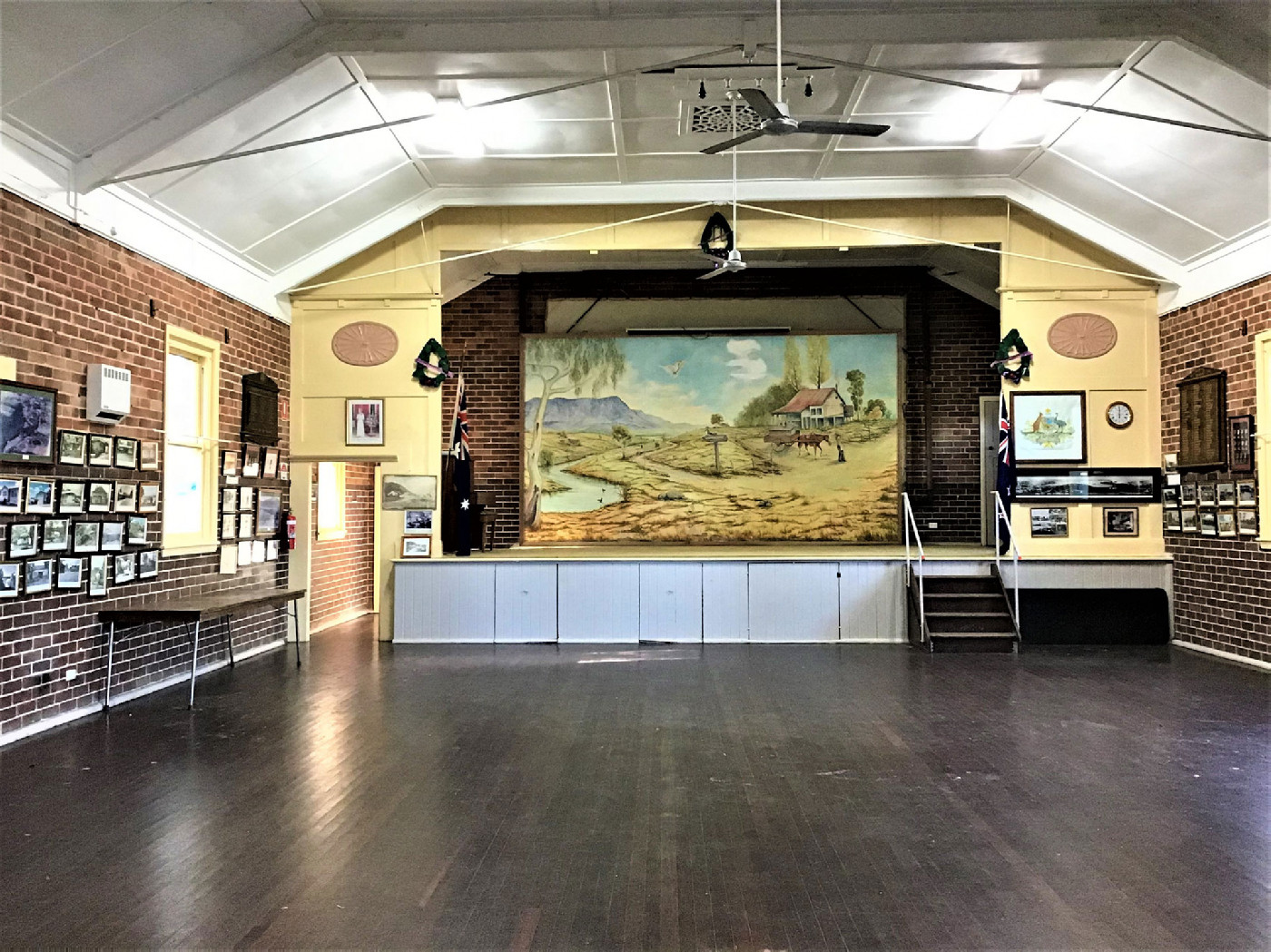 The old interior of the hall showing some of the framed photographs on display.